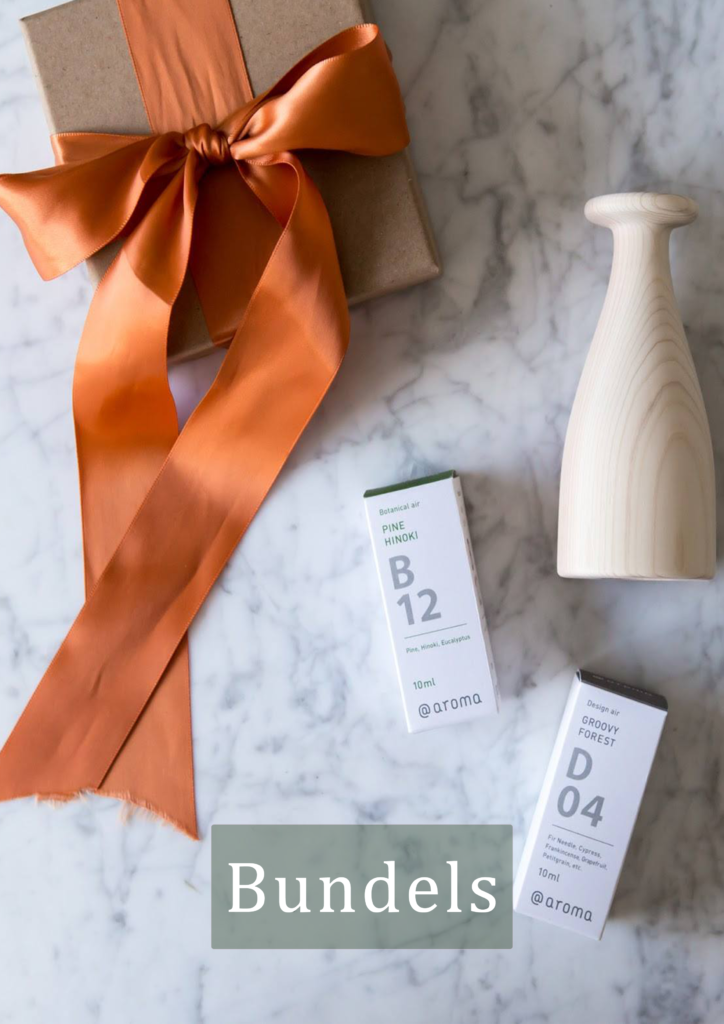 Cadeaubundel met houten geursysteem "Hinoco" en etherische olien B12 Pine hinoki en D04 Groovy Forest. Deze cadeauset is samengesteld door Geurdesign